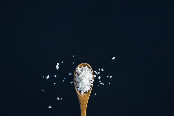 kosher salt on a wooden spoon