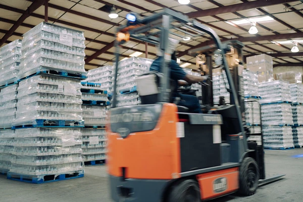 A forklift operator in the TEKPAK Marion, AL warehouse
