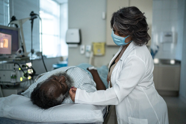 image of nurse attending patient