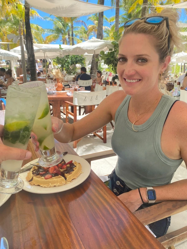 Having a mojito on the beach.