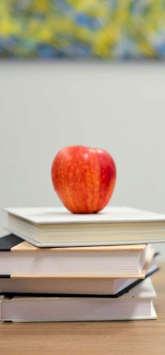 schoolbooks and an apple