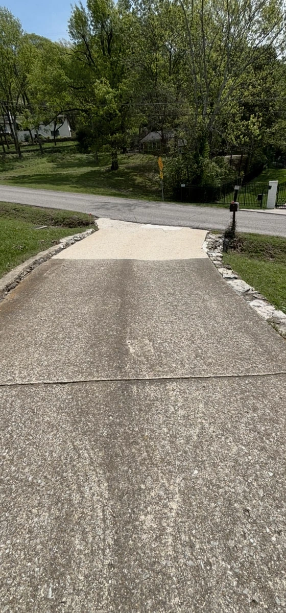 A driveway midway through being cleaned