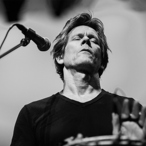 Kevin Bacon plays percussion