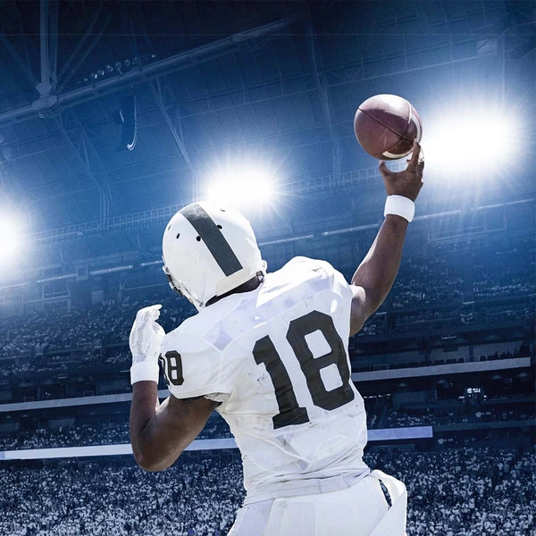 athlete catching football