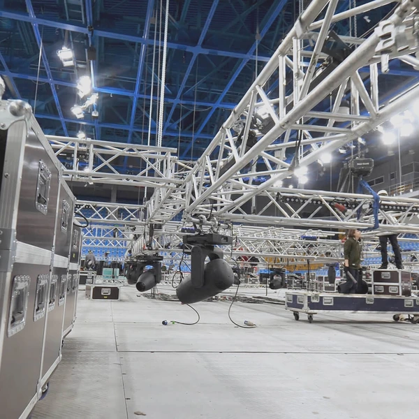 workers setting up lighting for a concert