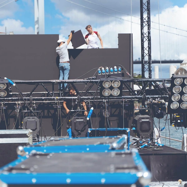 image of workers assembling gear on a stage