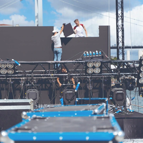 image of workers assembling gear on a stage