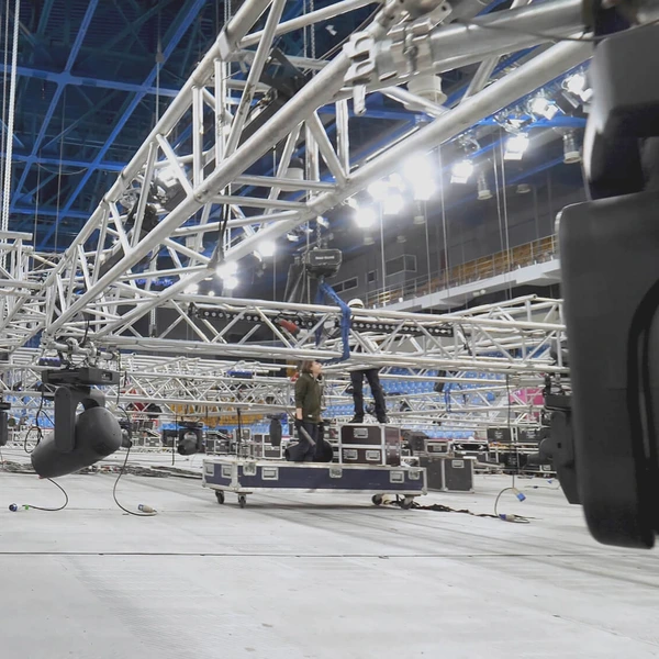 workers setting up lighting for a concert