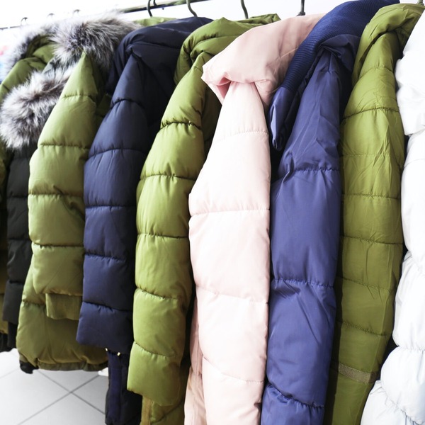 winter coats hanging on a rack