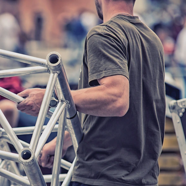 image of worker carrying rigging