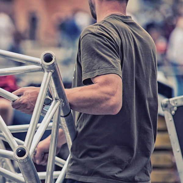 image of man carrying rigging